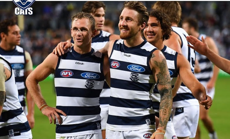 Zach Tuohy celebrates after his first Geelong game