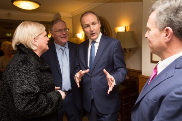 Fianna Fail leader Michael Martin chats to Sean Fleming at the party's dinner dance in the Castle Arms in Durrow