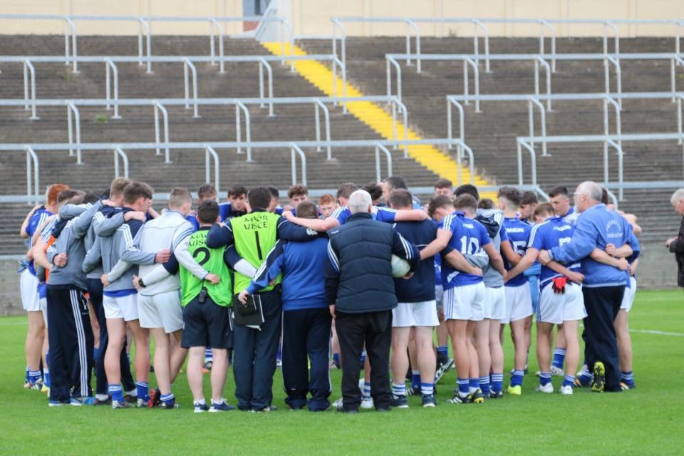 Malone and the rest of the Laois minor team in a huddle before throw-in
