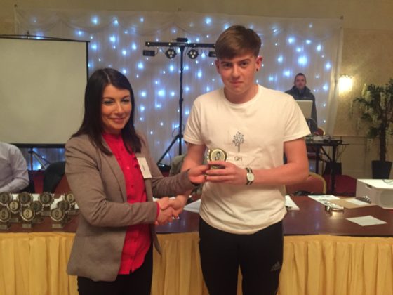 Shane Buggie of QRI winning third place in marketing at the PDST Get up and Go competition for TY Mini Company students in Kilkenny