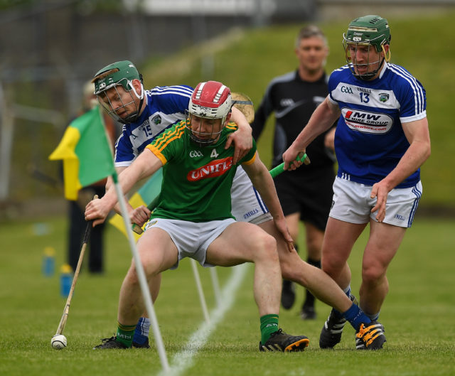 Cormac Reilly of Meath in action against Paddy Whelan and Willie Dunphy of Laois