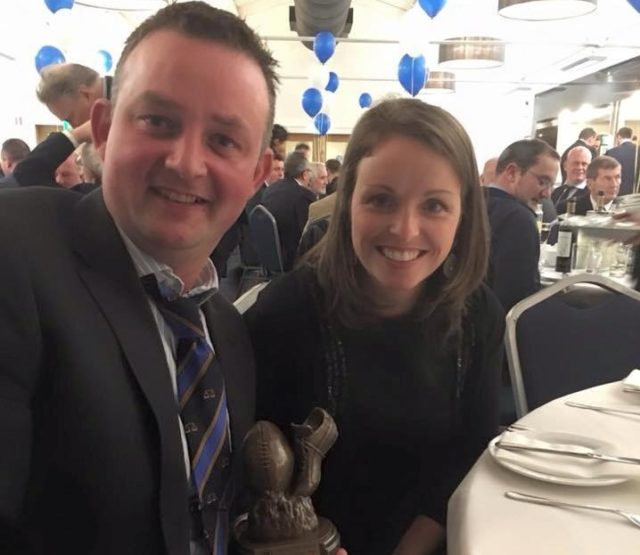 Portarlington referee Clive Wardrop with his wife Anne-Marie receiving his referee of the year award