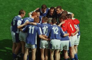 The Laois team pictured in a huddle before the match