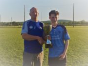 Ballyroan-Abbey Gaels captain accepts the cup from Danny Gorman