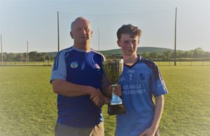 Ballyroan-Abbey Gaels captain accepts the cup from Danny Gorman