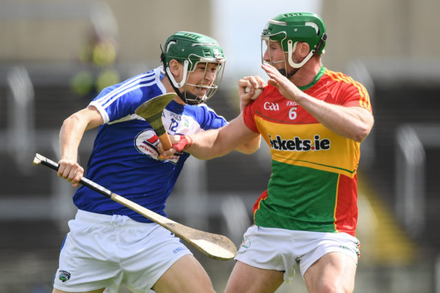 Sean Downey is tackled by David English of Carlow in todays game