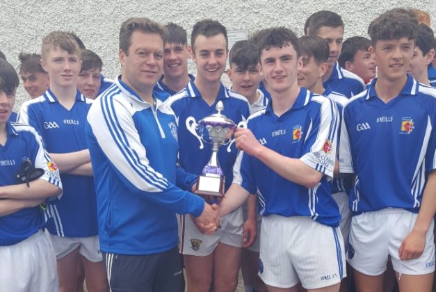 Mr Conway presents the Gearoid O'Sullivan Cup to captain of Good Counsel New Ross