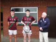 Portarlington joint captains Jordan Fallon and Eoin Kennedy with Laois GAA Chairman Gerry Kavanagh