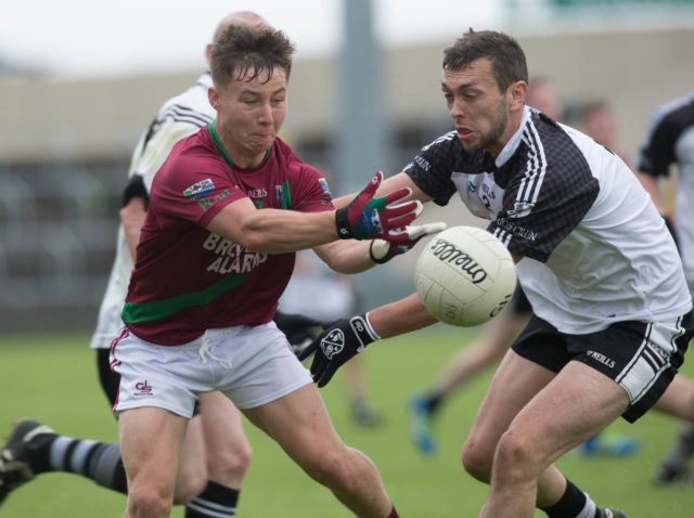 Jake Foster gets this pass away for Portarlington against Niall O'Rourke, Arles Killeen in the SFC at O'More Park. Picture: Alf Harvey/HRPhoto.ie