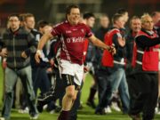 Arles-Kilcruise are safe for another year after a late win over Mountmellick Gaels tonight