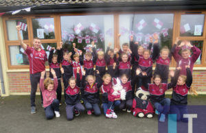 Mick Bermingham and his fourth class of Clonaghadoo NS getting ready for Kilcavan's JFC final