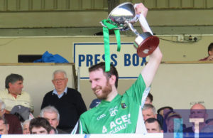 Ricky Quillinan lifts the cup as Ballyfin Gaels are crowned champions