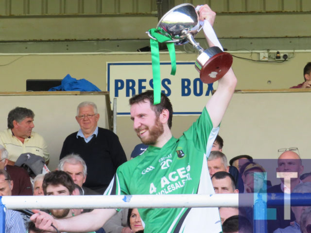Ricky Quillinan lifts the cup as Ballyfin Gaels are crowned champions