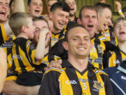 Joe Phelan and Zane Keenan receive the Bob O'Keeffe Cup from Seamus Mortimer