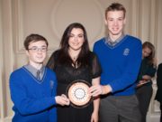 Patrick Kelly and Conor Doran with Teacher Teresa Egan collecting Knockbeg's award
