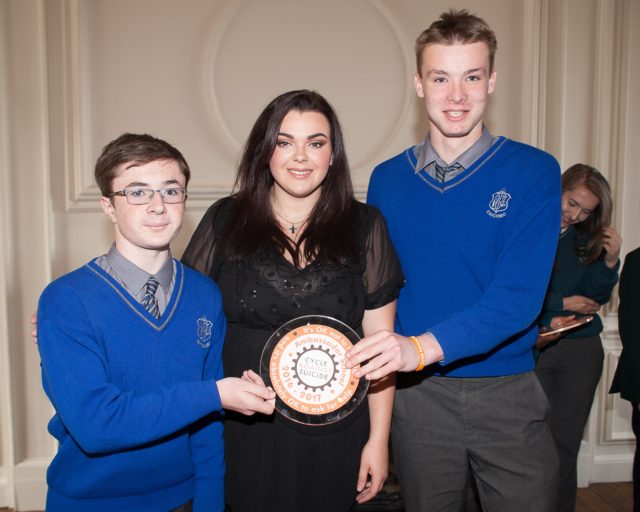 Patrick Kelly and Conor Doran with Teacher Teresa Egan collecting Knockbeg's award