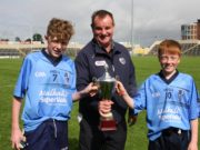 Ballyroan-Abbey joint captains Shaun Fitzpatrick and Michael O'Connor receive the U-14 cup from Brian Allen. Pic: Dave Maher