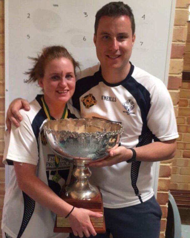 Maebh Moriarty, from Armagh, with Conor O'Regan and the Australasian Games trophy