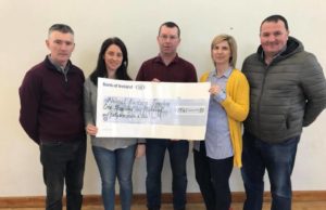 Ms Dooley and Ms Mulhare receive the cheque from Francis Devitt, committee member, Michael Miller Chairman and Liam Ramabottom Intermediate football manager