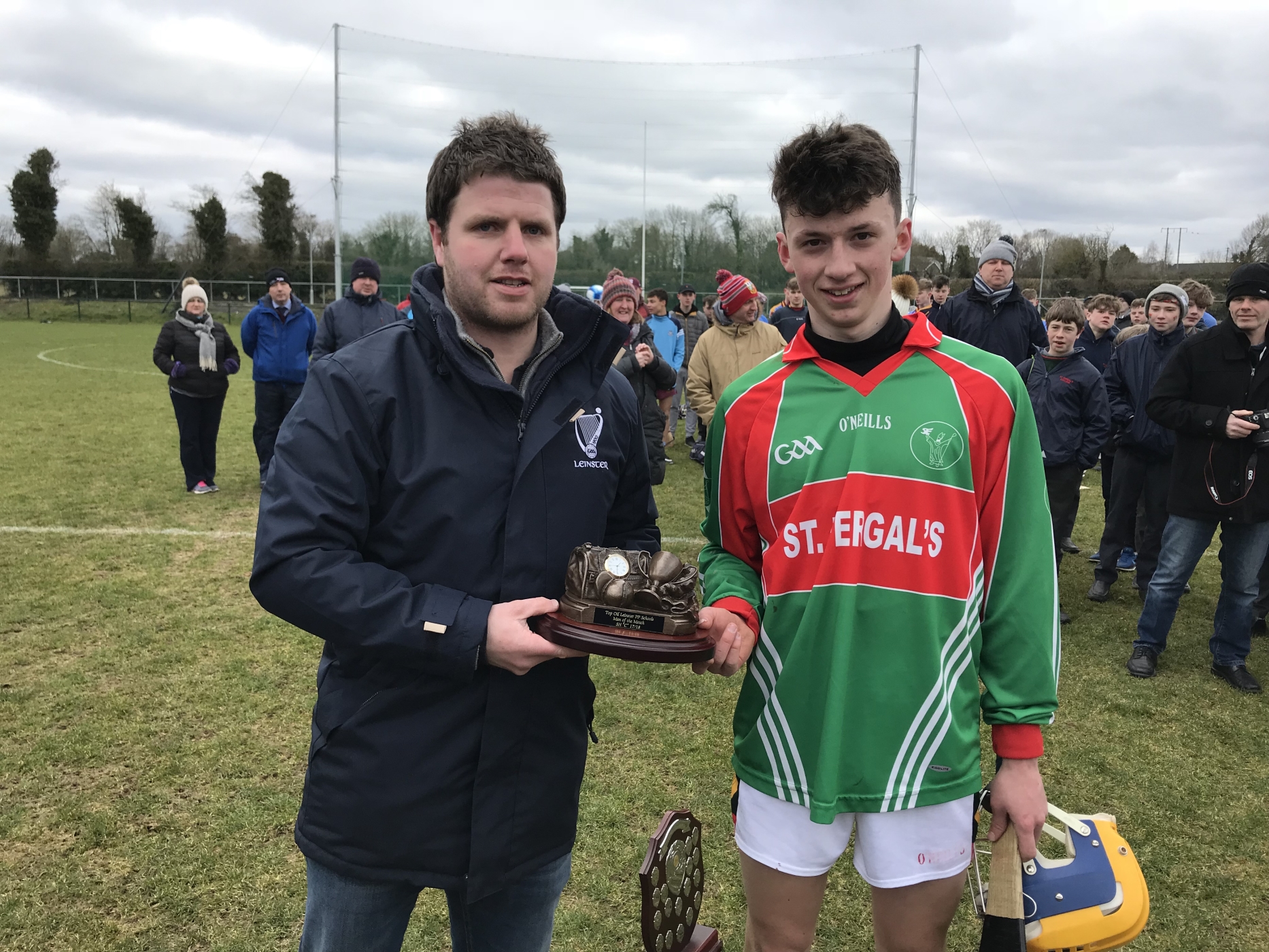 Man of the match Kevin Mulhall collects his award from Leinster GAA's Tadhg Doran