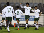 Anselmo Garcia McNulty of Republic of Ireland celebrates with, Conrad Egan Riley and Colin Conroy after scoring his side's first goal during the Under 15 International Friendly match between Republic of Ireland and Cyprus at Oriel Park in Dundalk, Co Louth