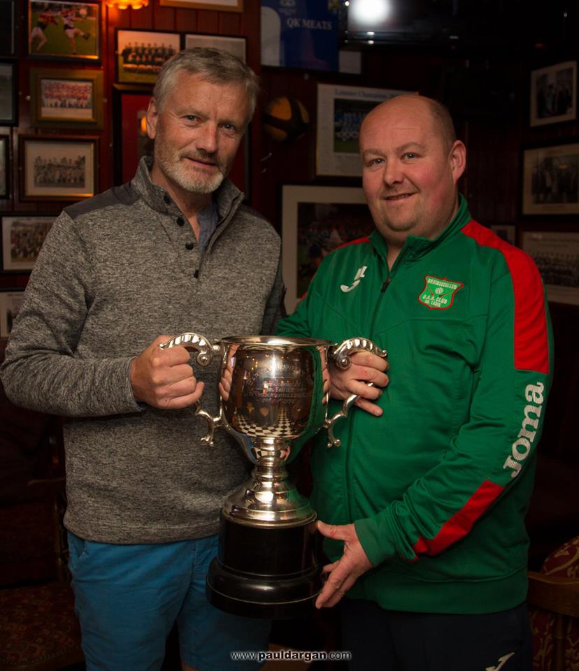 Declan O'Loughlin handing over the Barney Hennessy Cup to Graiguecullen chairman Michael Lawler