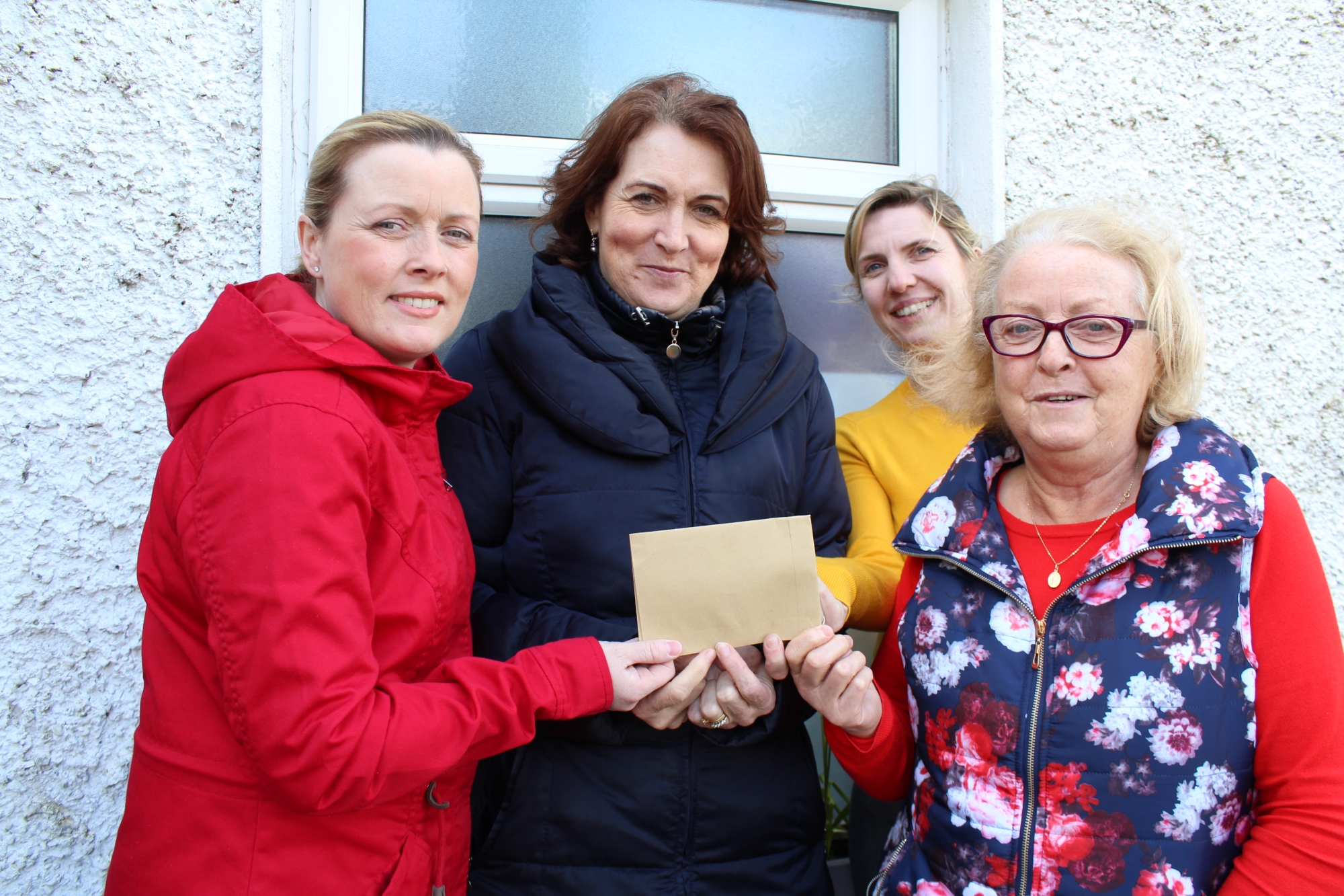 Janice and Mary Carthy present a cheque for €1000 for Naíscoil Kantara to Timahoe NS principal Ann Bergin and teacher Orla Mulhare.