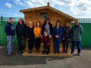 Members of Midlands Down Syndrome with their new playhouse