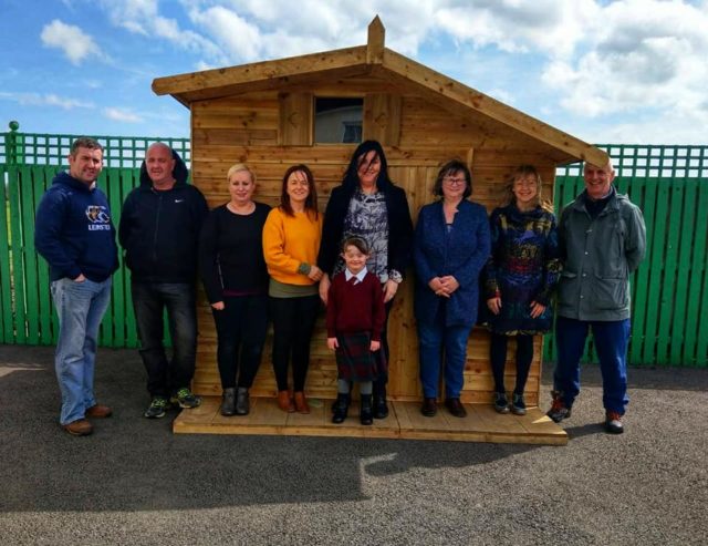 Members of Midlands Down Syndrome with their new playhouse