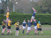 Adam Duffin goes highest lifted by Paddy Coss and Alan Maher