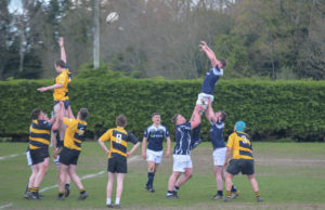 Adam Duffin goes highest lifted by Paddy Coss and Alan Maher