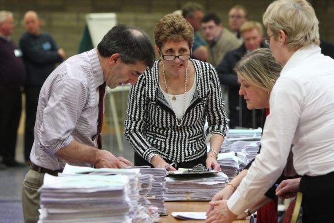 Returning officer Verona Lambe (centre) assisted by Declan Byrne, Laois County Council; Ruth McNally Offaly County Council and Elizabeth Sharkey, returning officer Westmeath checking votes on day 3 of the General Election 2011 Laois/Offaly Count at the count centre in Tullamore.