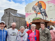 The 'Into the West' Mural launch at the Old Cinema, Portarlington was part of Cruinniú na nÓg; a national day of free creativity for children and young people. L-R, Darren Warren (artist assistant); ADW, mural artist; Portarlington local, Sadie Hainsworth, who played the role of a cleaner in the film, Muireann Ni Chonaill, Arts Office Laois Co. Council; and actor Rúaidhrí Conroy who played 'Tito' in the film.