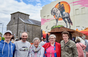 The 'Into the West' Mural launch at the Old Cinema, Portarlington was part of Cruinniú na nÓg; a national day of free creativity for children and young people. L-R, Darren Warren (artist assistant); ADW, mural artist; Portarlington local, Sadie Hainsworth, who played the role of a cleaner in the film, Muireann Ni Chonaill, Arts Office Laois Co. Council; and actor Rúaidhrí Conroy who played 'Tito' in the film.