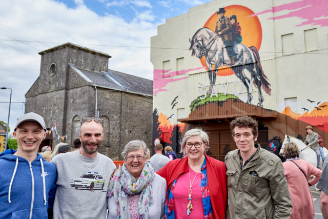 The 'Into the West' Mural launch at the Old Cinema, Portarlington was part of Cruinniú na nÓg; a national day of free creativity for children and young people. L-R, Darren Warren (artist assistant); ADW, mural artist; Portarlington local, Sadie Hainsworth, who played the role of a cleaner in the film, Muireann Ni Chonaill, Arts Office Laois Co. Council; and actor Rúaidhrí Conroy who played 'Tito' in the film.