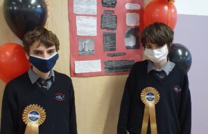 St Mary’s CBS students Sean Maher (navy mask) and Daniel Corbett (white mask) with their winning project
