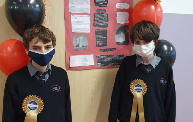 St Mary’s CBS students Sean Maher (navy mask) and Daniel Corbett (white mask) with their winning project