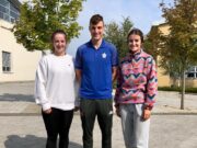 Ella Byrne collecting her results with her Physical Education teacher John Scully and fellow past pupil Eleanor Healy