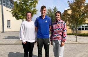 Ella Byrne collecting her results with her Physical Education teacher John Scully and fellow past pupil Eleanor Healy