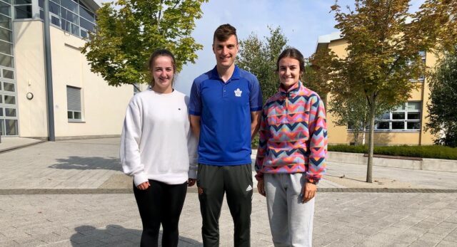 Ella Byrne collecting her results with her Physical Education teacher John Scully and fellow past pupil Eleanor Healy