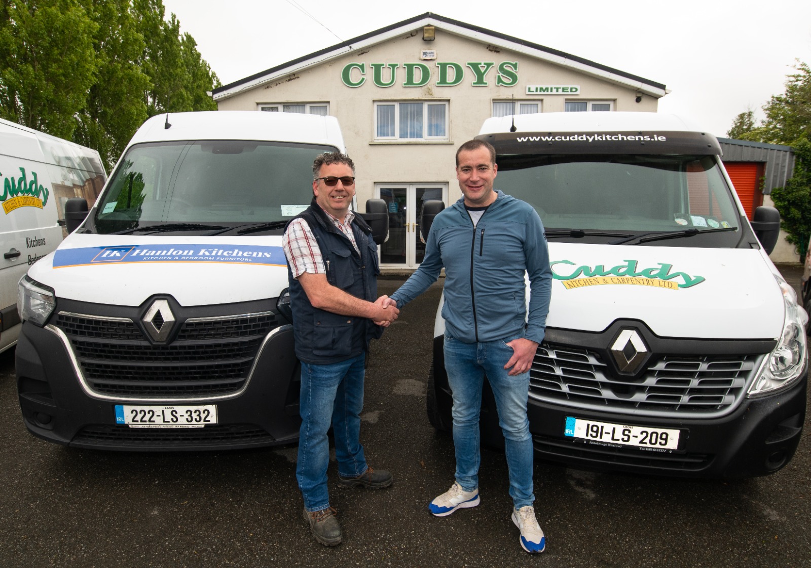 Danny Hanlon, owner of Hanlon Kitchens shakes hands with Declan Cuddy solidifying the acquisition