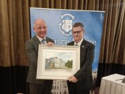 Michael Regan presents Mike Carew with a painting of Knockbeg College on behalf of the Board of Management